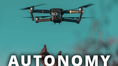 hand releasing drone with text AUTONOMY