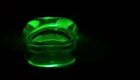 A neon green, semi-transparent, pill-shaped blob 