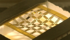 A grid of gold filaments with forming waves together on a test platform 