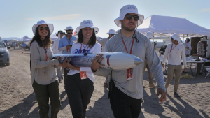 Duke students move hold a high-powered rocket