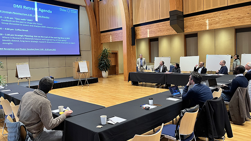 People sit around a U-shaped block of desks in Duke's Karsh Alumni and Visitor Center