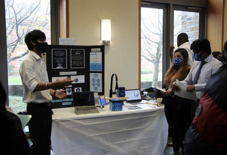 engineering students and a research poster