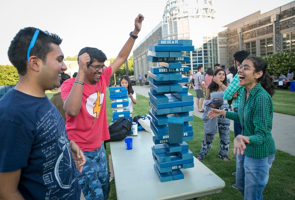 master's students play an outdoor game