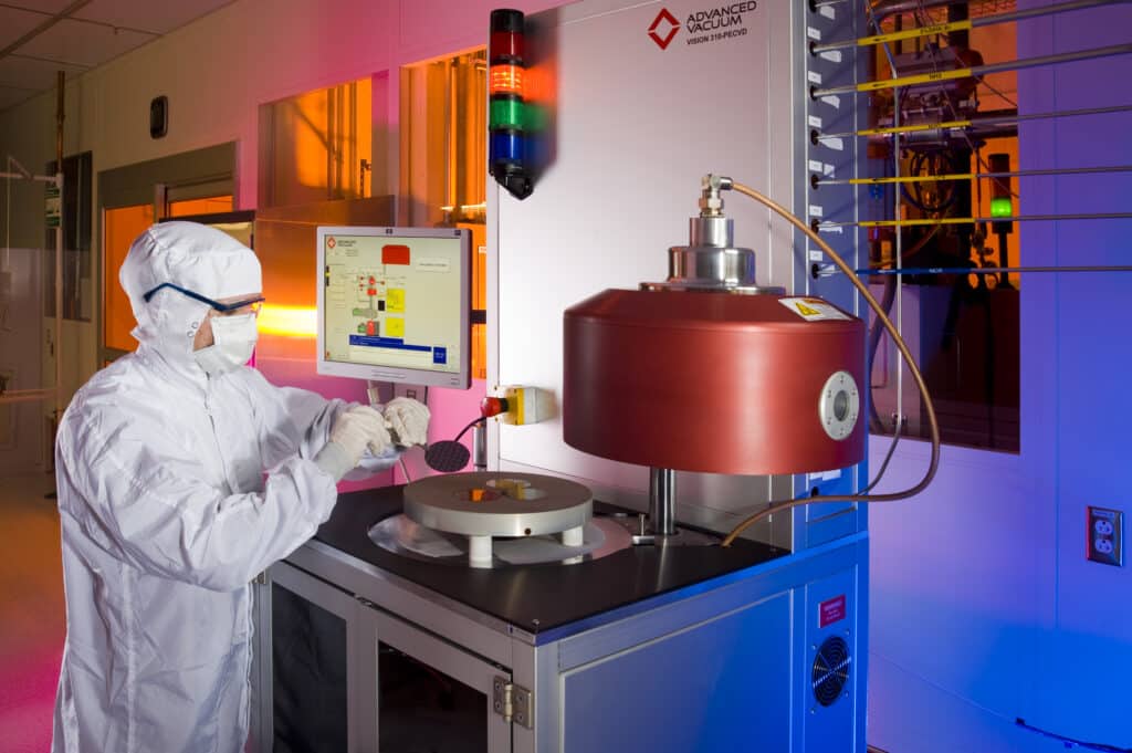 student working in the SMIF cleanroom