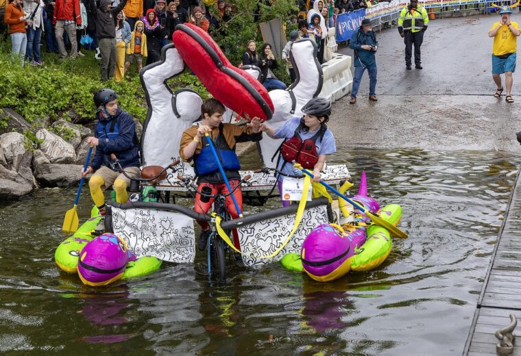 a kinetic structure and artists ford a stream