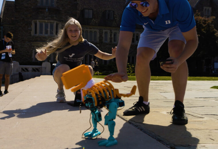 a student built-robot shaped like a T. Rex dances at Duke University